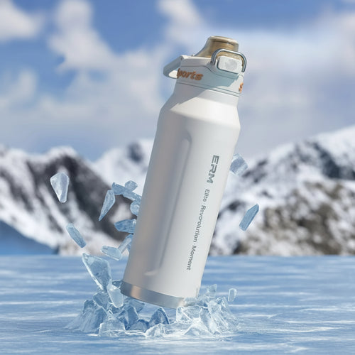 Stainless steel water bottle with ice cubes and promotional text on a snowy background